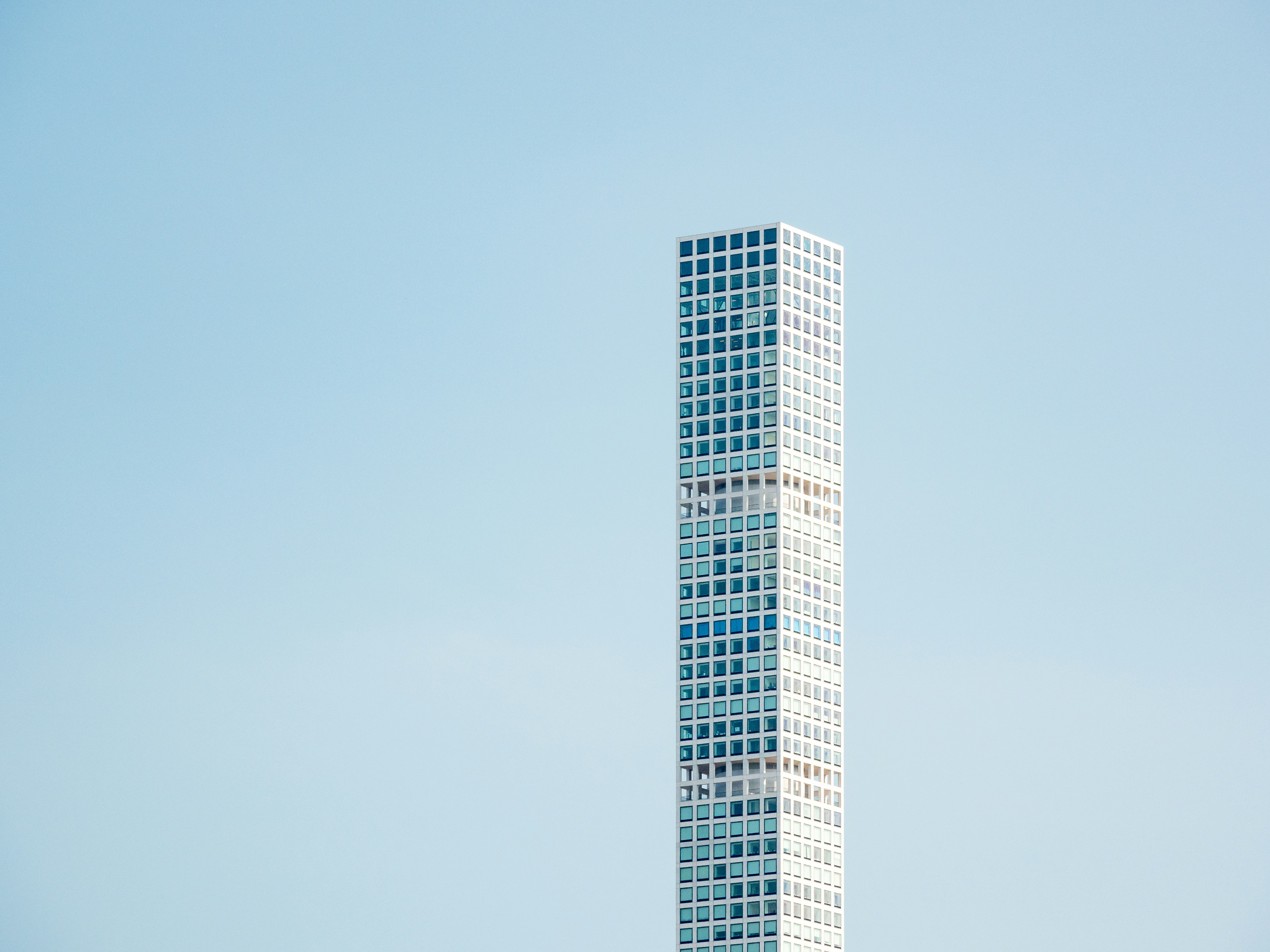 white and black concrete building under blue sky during daytime